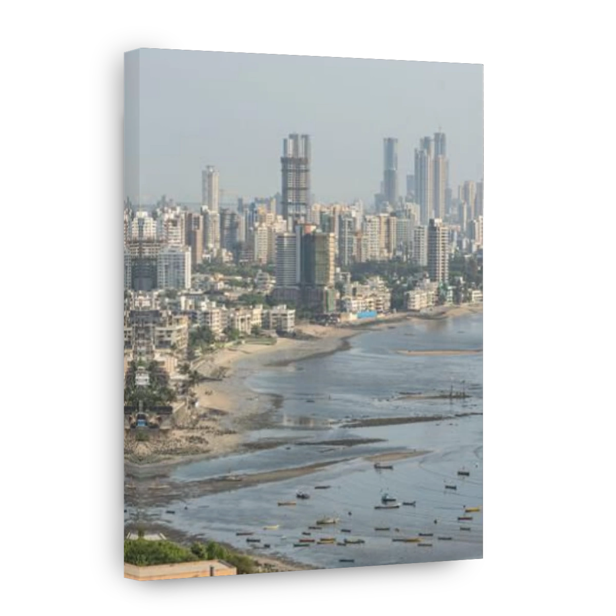 An aerial view of cityscape Mumbai surrounded by buildings and water