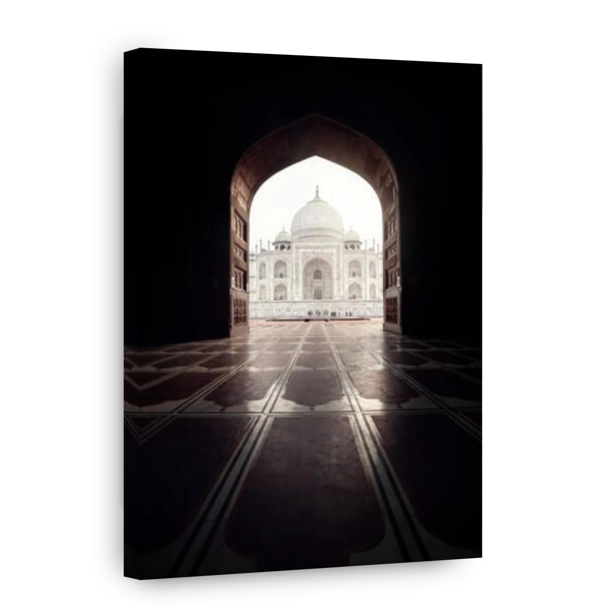 Taj Mahal view in black arch silhouette from the mosque in Agra, Uttar Pradesh, India