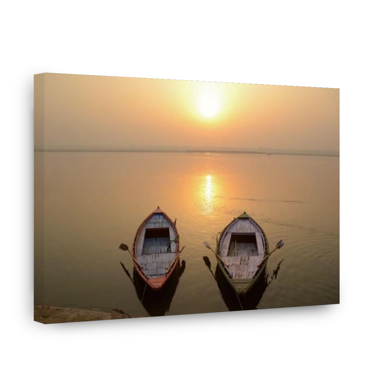 Two empty boats on the Ganges river near ghats on sunset time, Varanasi, India