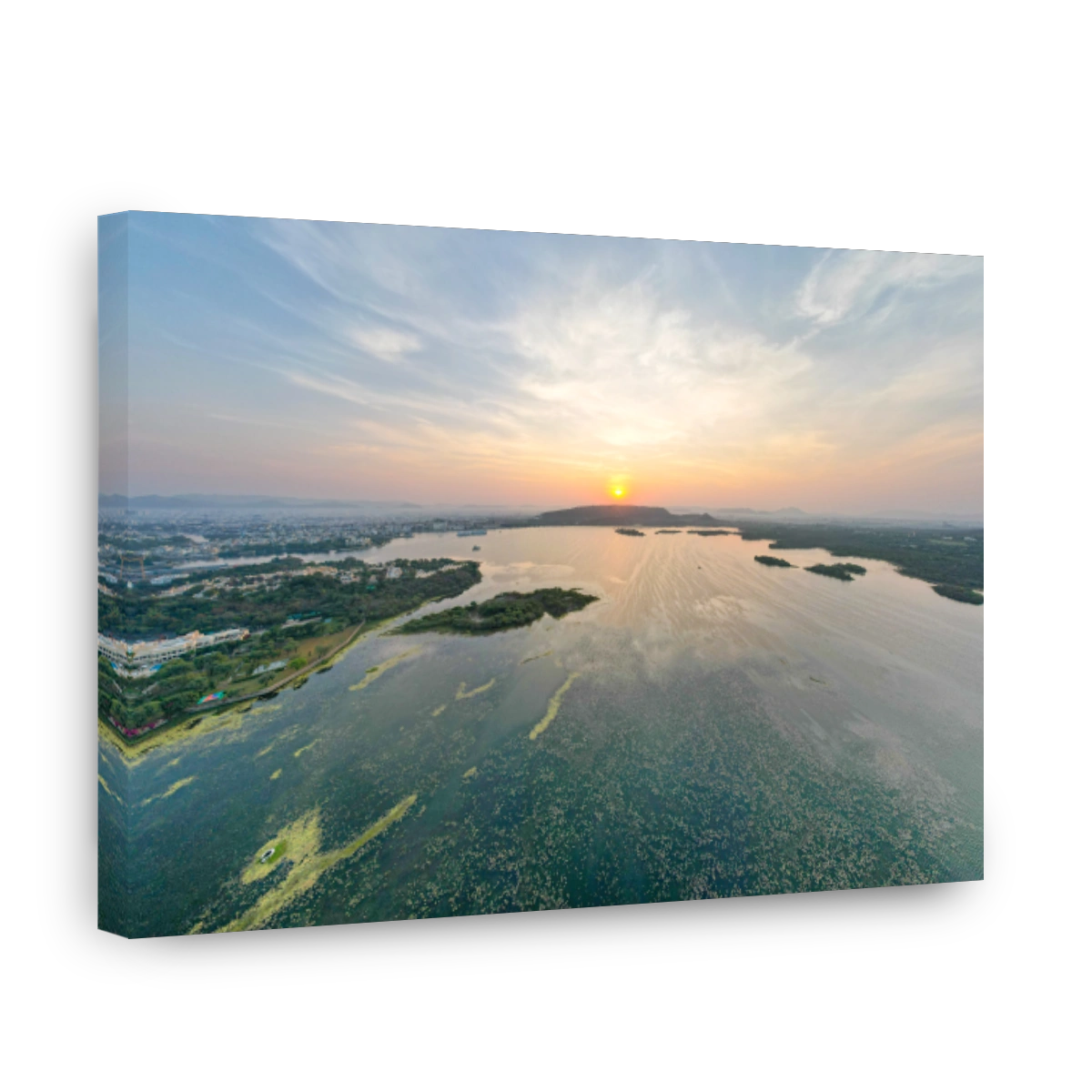 Aerial drone shot dawn dusk cityscape of Udiapur Rajasthan India with blue pink purple water of lake pichola fateh sagar towards aravalli mountains on foggy morning