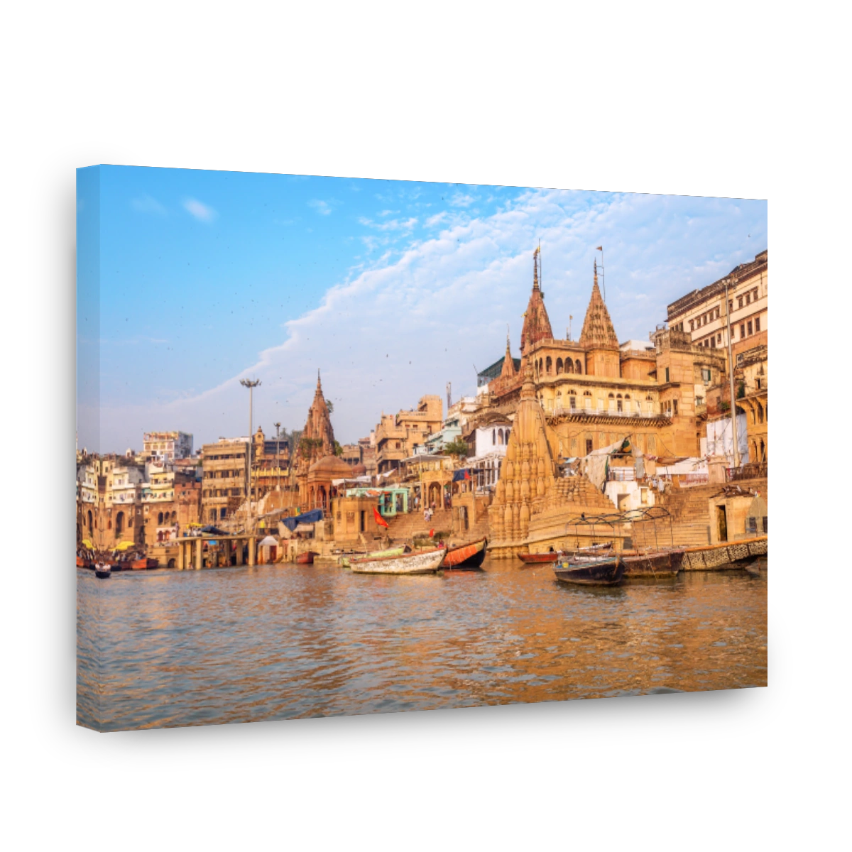 Varanasi ancient city architecture with wooden boats by the Ganges river ghat