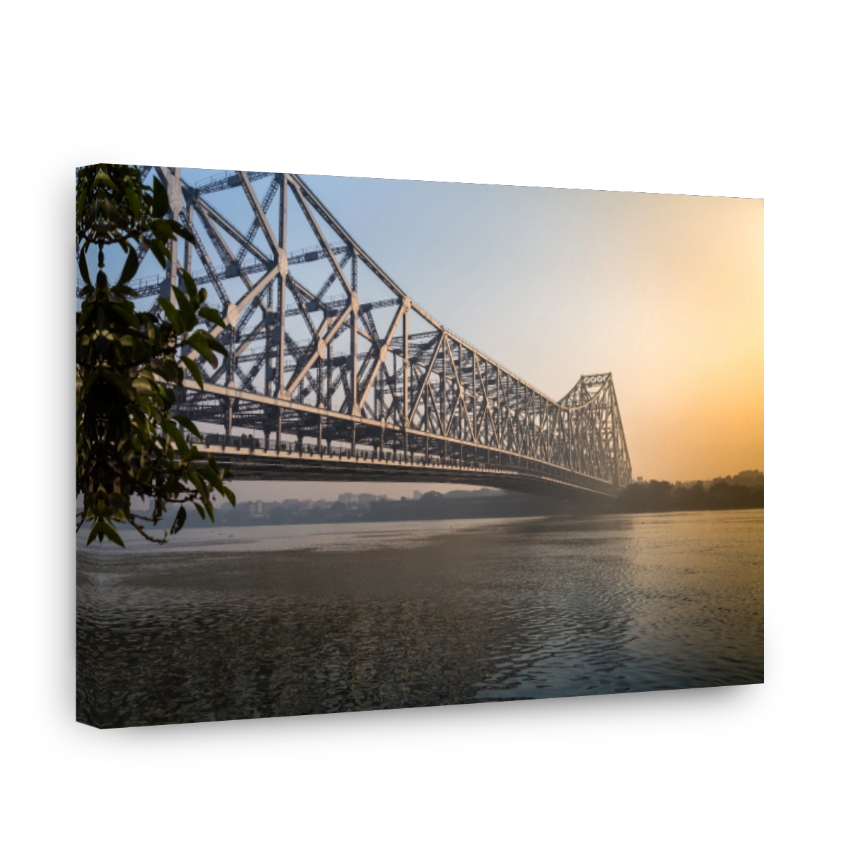 Historic Howrah bridge on river Hooghly at sunrise.