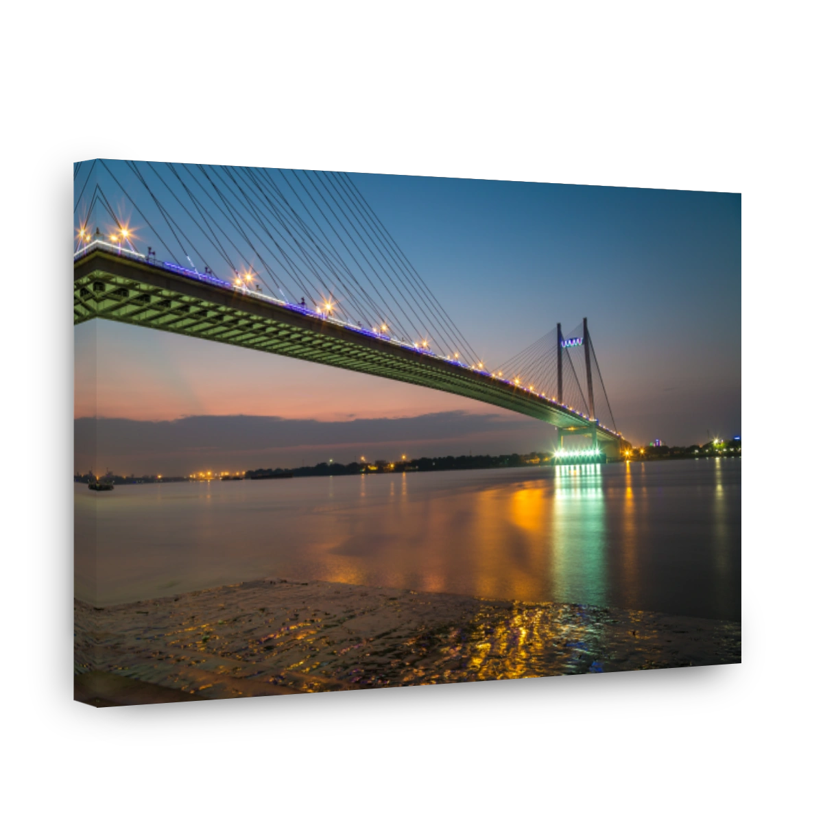 Vidyasagar bridge (Setu) on river Hooghly at twilight with city illumination.