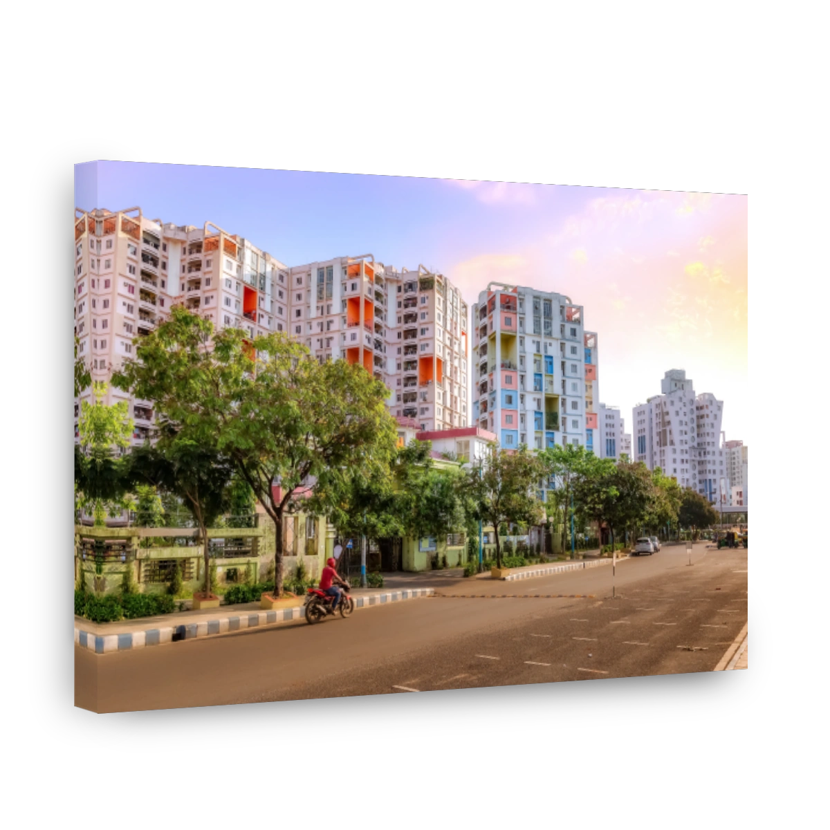City residential apartment buildings with view of city road at sunrise