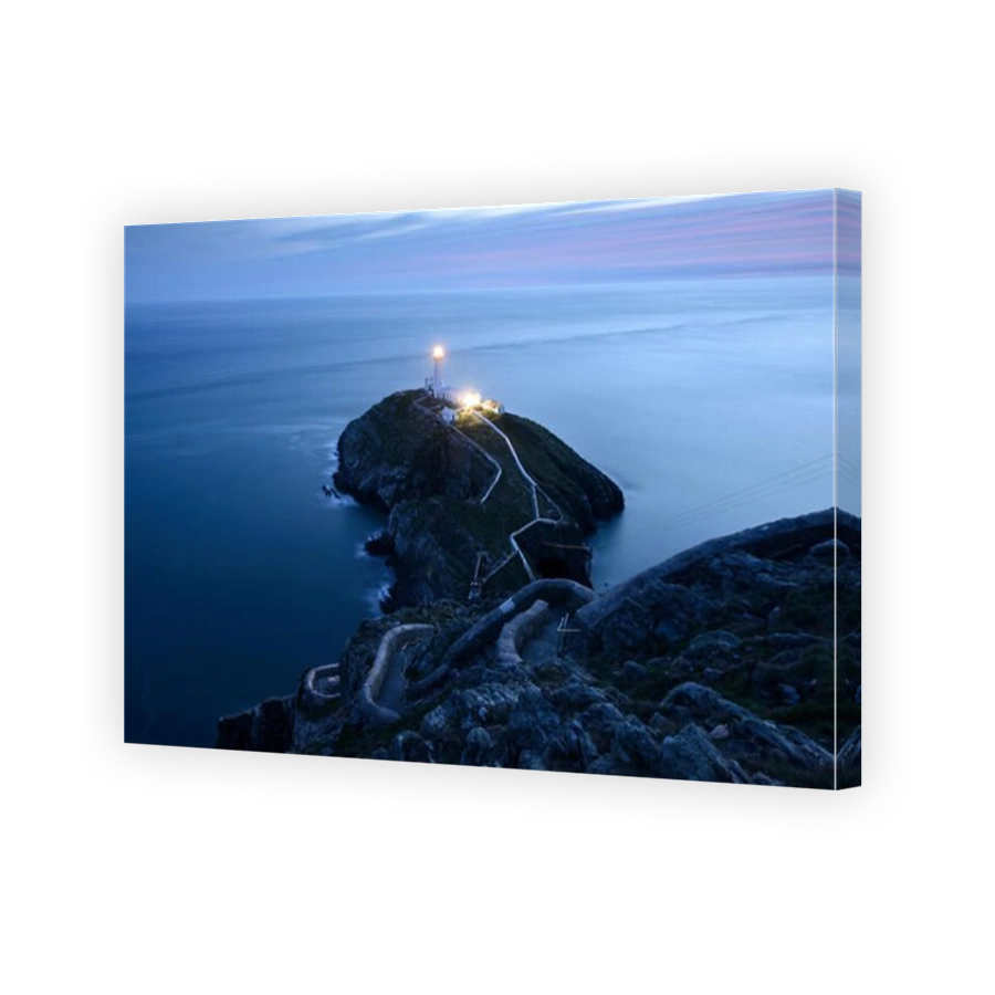 South Stack Lighthouse, Anglesey, illuminated at dusk.