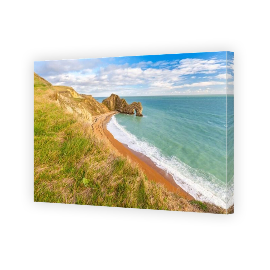 Aerial view at sunset of the Durdle Door, a natural limestone arch on the Jurassic Coast near Lulworth in Dorset, Southern England.