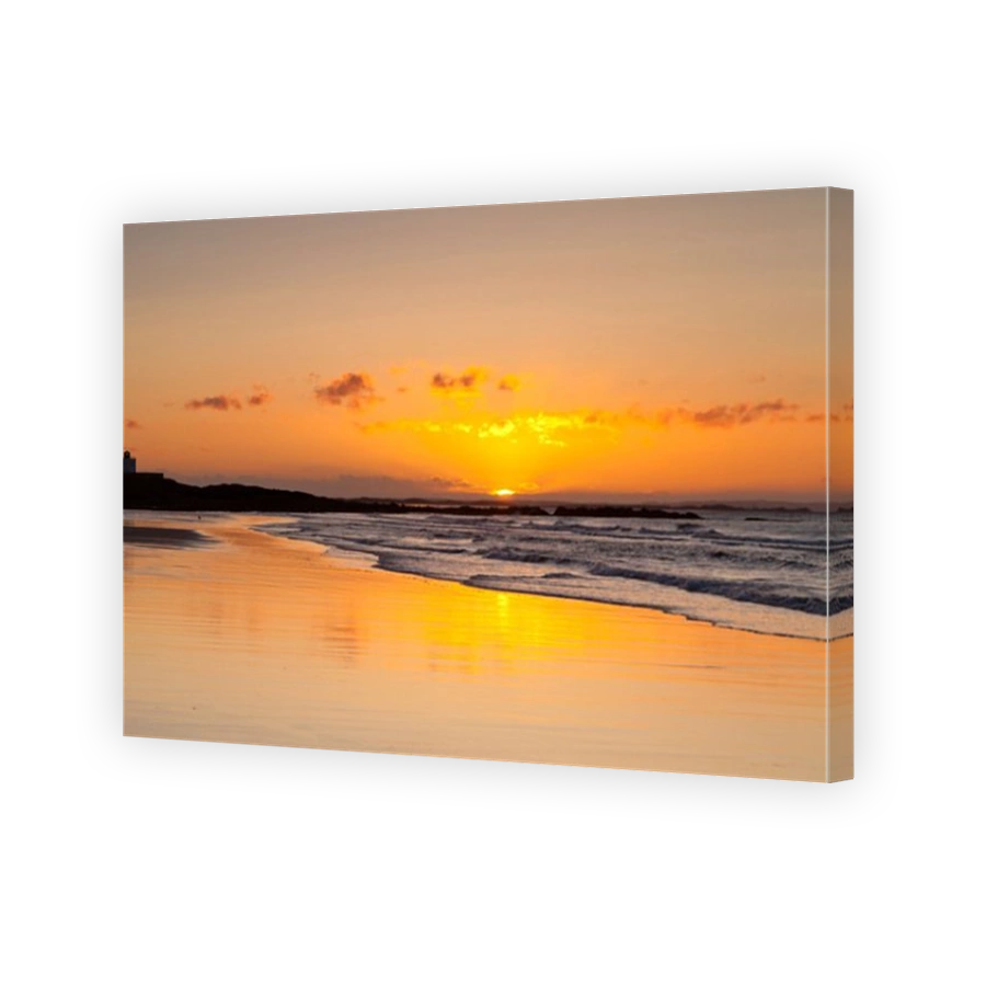 Sunrise at Bamburgh Beach on a spring morning, Northumberland, England.