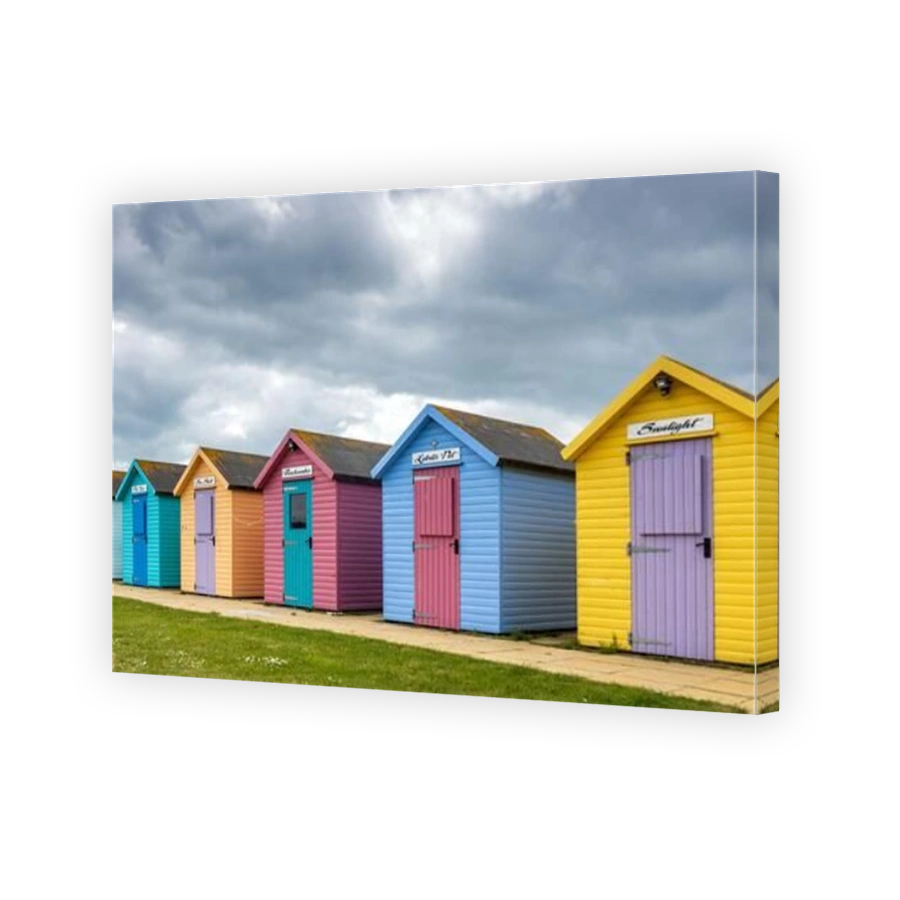 The colourful beach huts at Amble on the Northumberland coast, England, Uk.