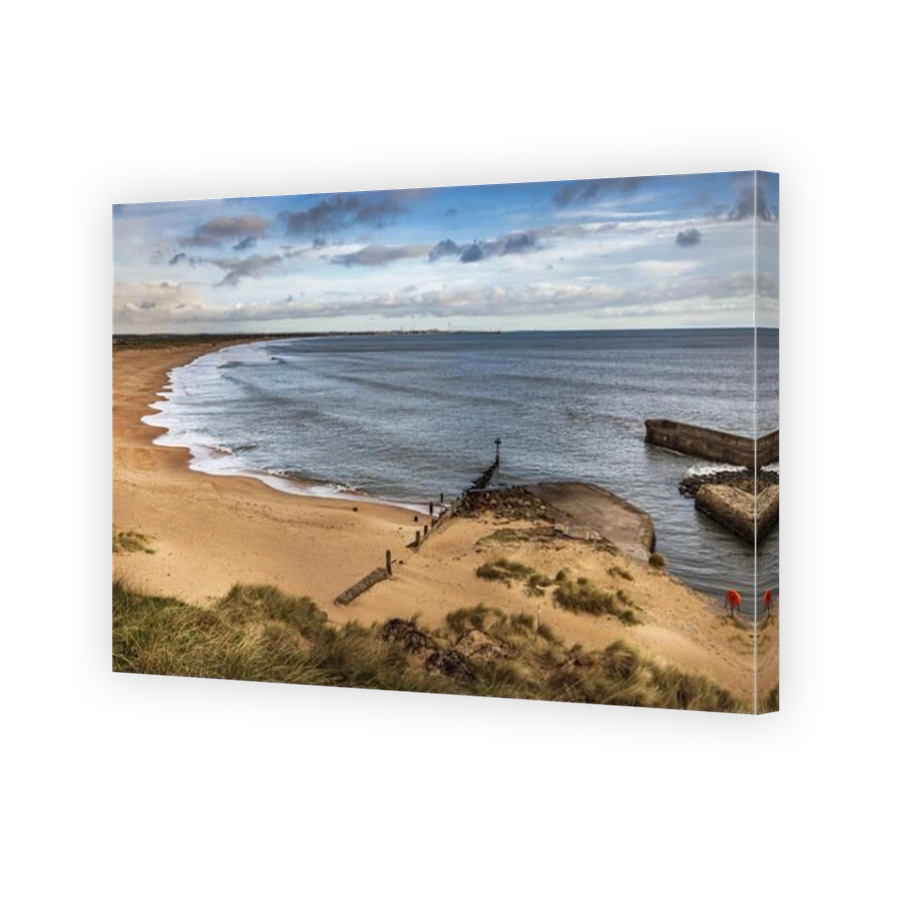 Looking north across Seaton Sluice beach towards Blyth, with the harbour mouth to the right, Northumberland,