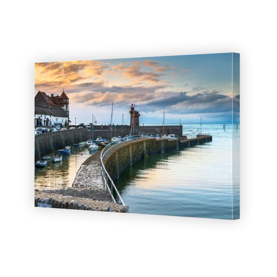 As the sun goes down the streetlights flicker on around the picturesque little North Devon harbour of Lynmouth.