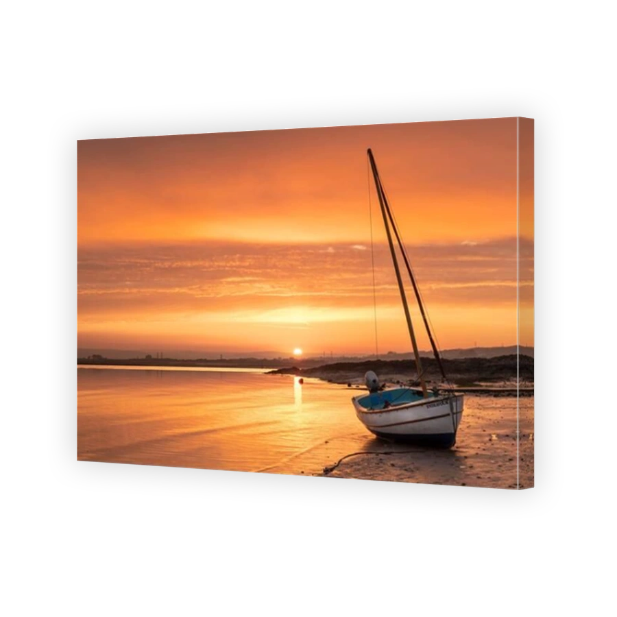 Appledore, North Devon, England. Tuesday 20th April 2021. UK Weather. A beautiful sunrise over a tranquil River Torridge estuary as the incoming tide creeps along the shoreline at Appledore. Today hazy sunshine and light winds are forecast for the coast o