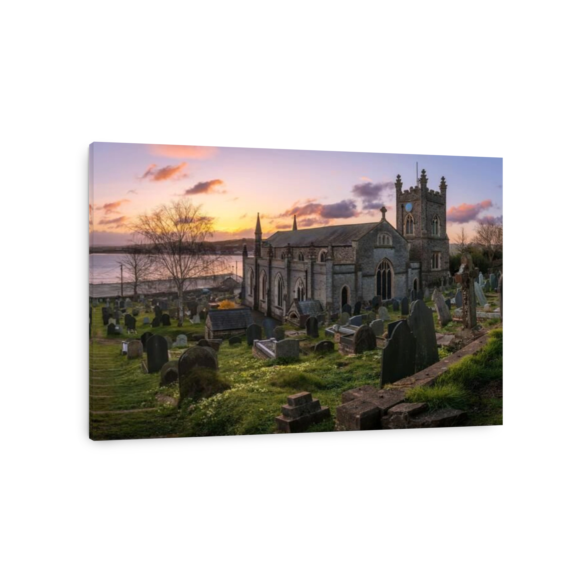 Appledore, North Devon, England. Saturday 27th March 2021. UK Weather. A beautiful start to the day over the River Torridge estuary, as the sun lights up the small churchyard of St. Mary's and the springtime primroses, in the picturesque coastal village o