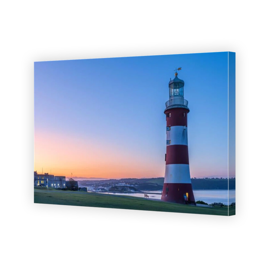 Plymouth, Devon, England. Thursday 19th September 2019. UK Weather. After another clear and chilly night, the first rays of sunshine appear behind Smeatons Tower on The Hoe, lighting up the harbour in Plymouth, Devon, South West England . Terry Mathews/Alamy Live News.
