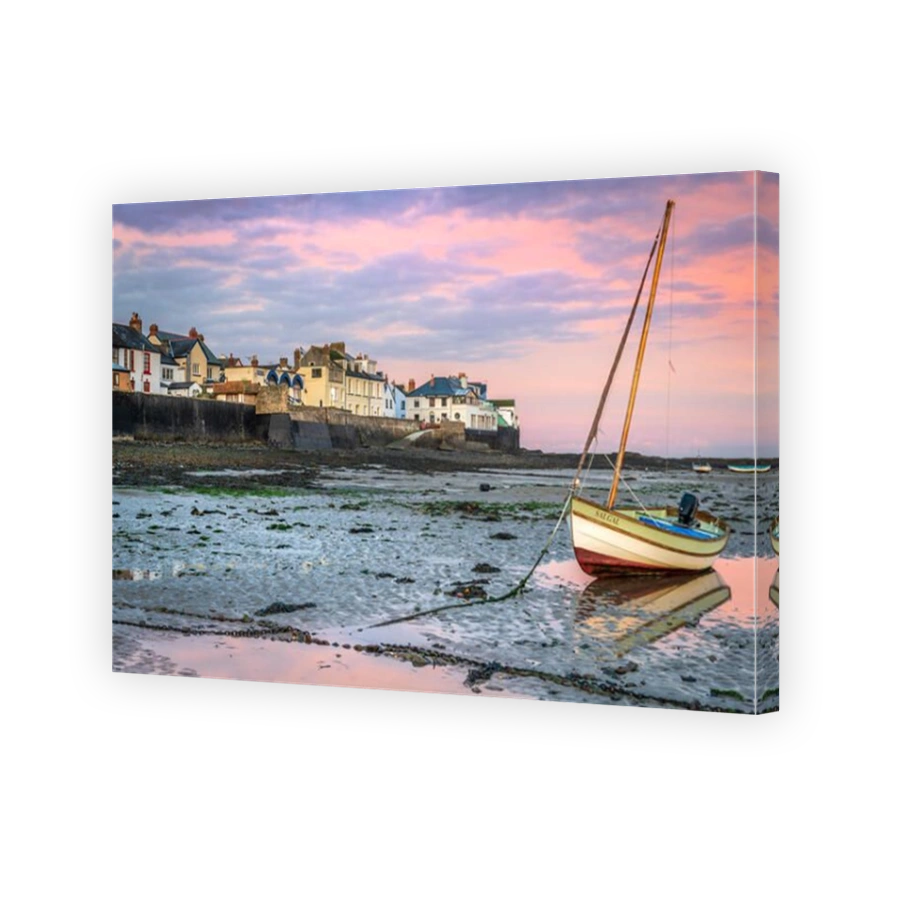 Appledore, North Devon, England.  After a cold clear night, at dawn broken cloud allows the sun to light up the River Torridge estuary at the coastal