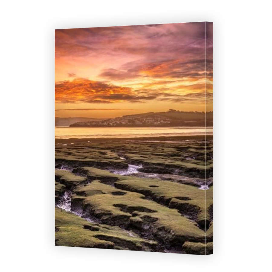 Northam Burrows near Appledore, North Devon, England. Monday 7th February. As the sun rises behind the coastal villages of Appledore and Instow, the