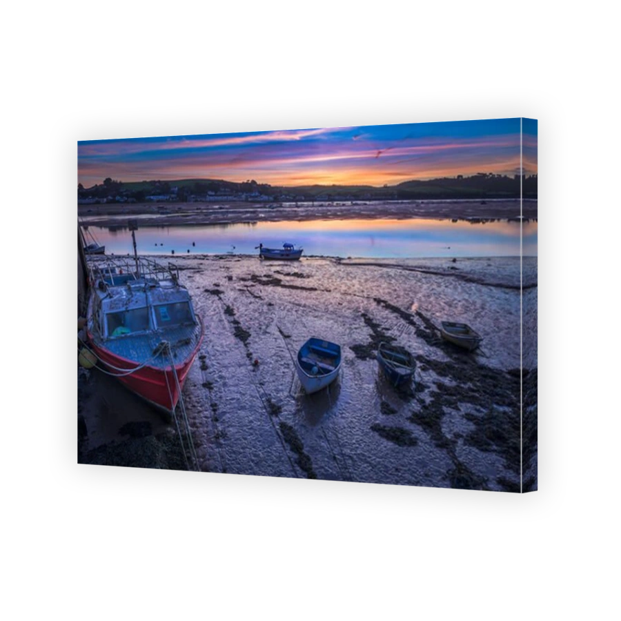 The sun rises an hour earlier, over the Devon coastal village of Instow, after the clocks go back to signal the end of British Summertime