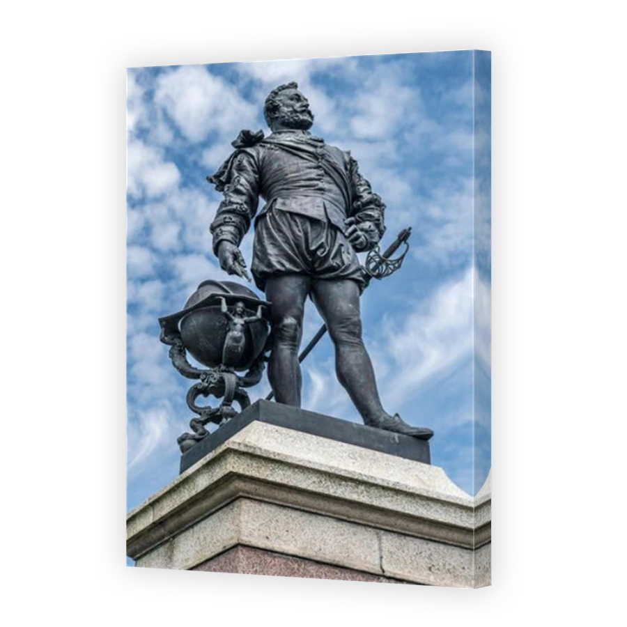 The famous statue of Sir Francis Drake stands facing out to sea on a plinth on Plymouth Hoe in South Devon.