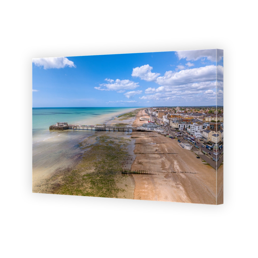 Drone aerial view of Worthing Pier and the beach of the city.