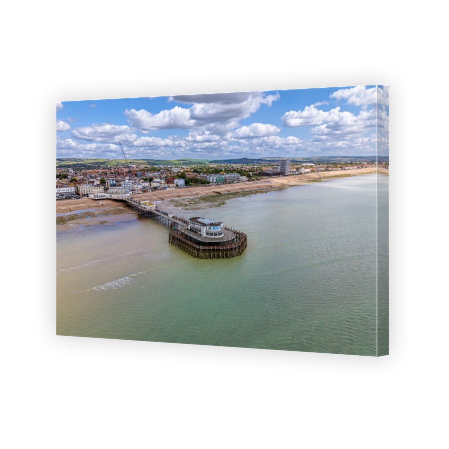 Drone aerial view of Worthing Pier and the beach of the city.