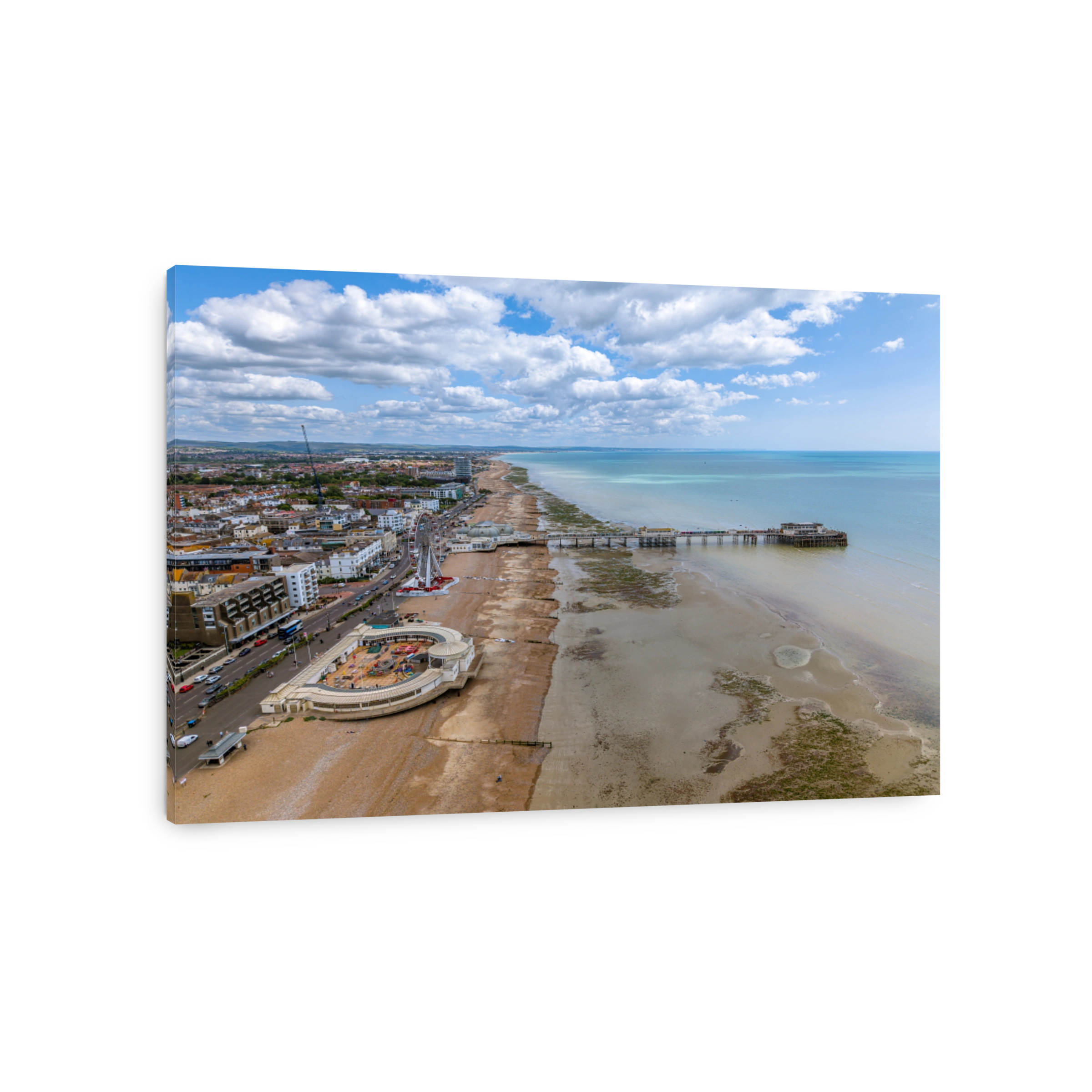 Drone aerial view of Worthing Pier and the beach of the city.