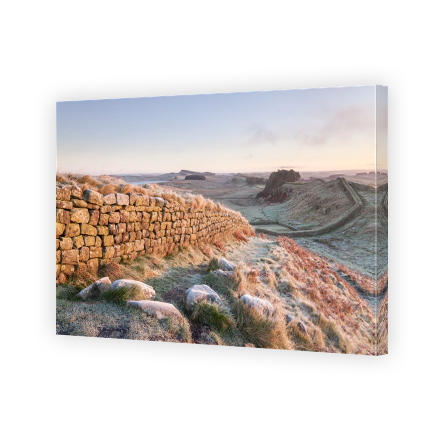 Hadrians Wall near Housesteads on a cold and frosty morning in winter time in Northumberland