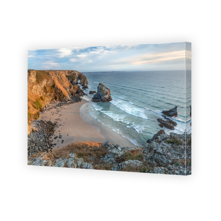 View from the clifftop over Bedruthan Steps Sea Stacks and Beach, at mid-tide in July.