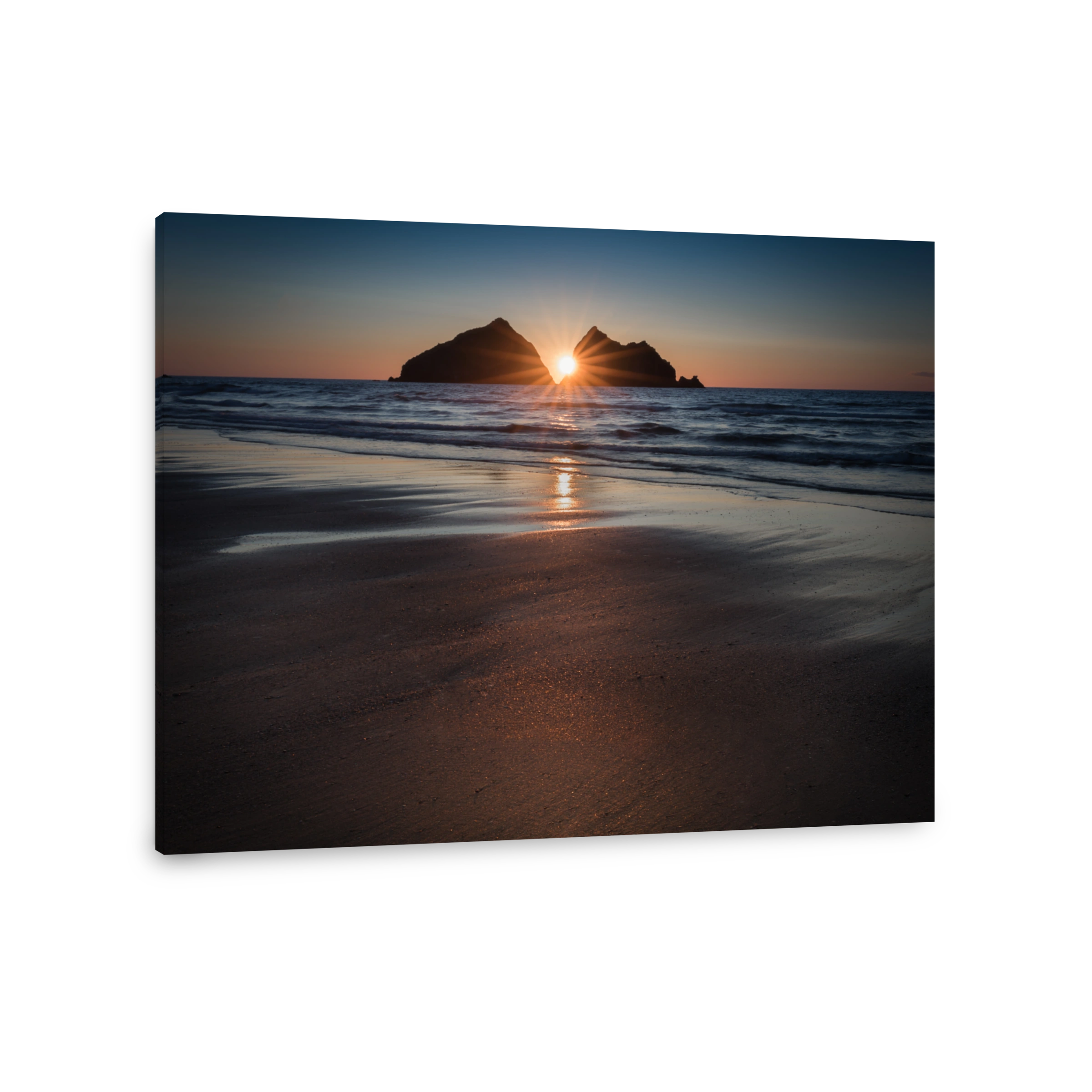 Sunstar Sunset reflecting over deserted beach, Holywell Bay, Cornwall
