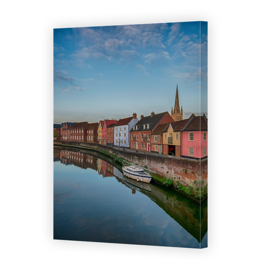 Buildings By River Against Sky In City