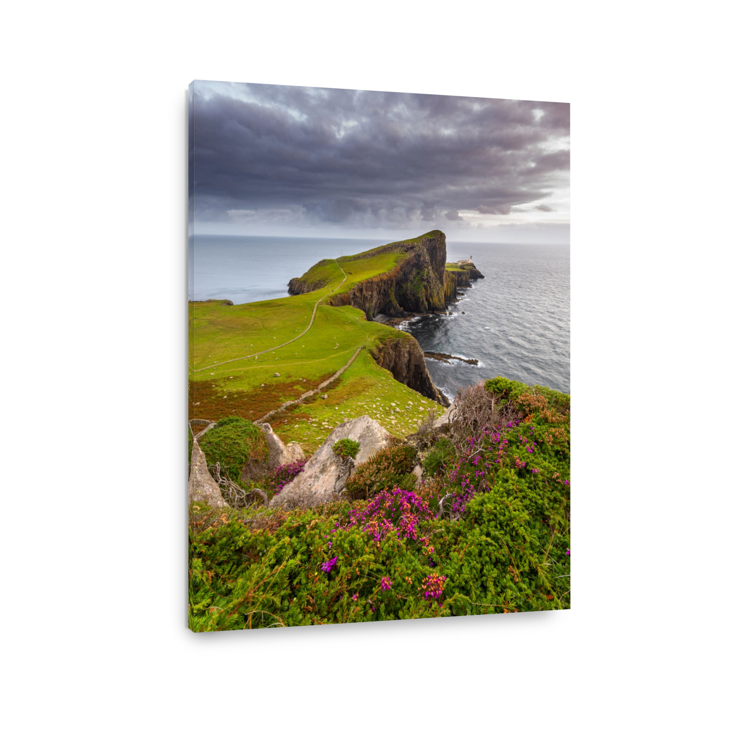 View of Neist Point on the Isle of Skye with dramatic clouds out to the coast. Scotland, UK.
