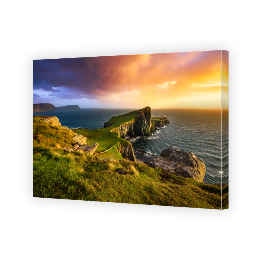 Colourful sunset at Neist Point lighthouse in Scotland. Isle of Skye.