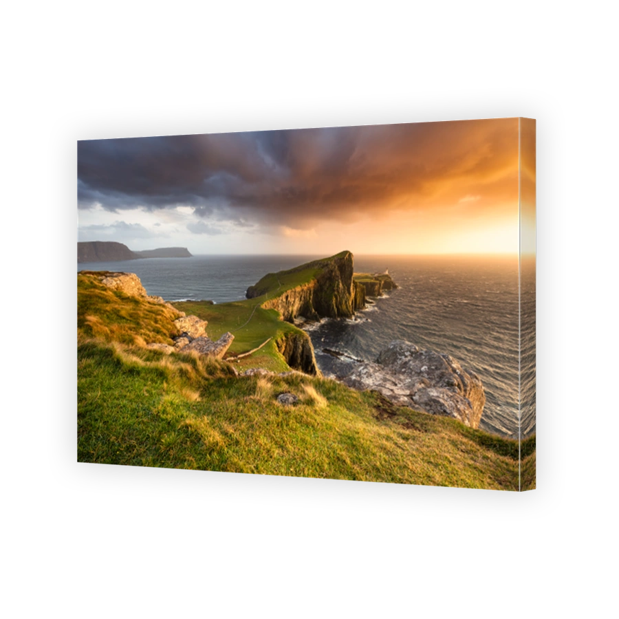 Dramatic sunset at famous landmark Neist Point Lighthouse on the Isle of Skye.