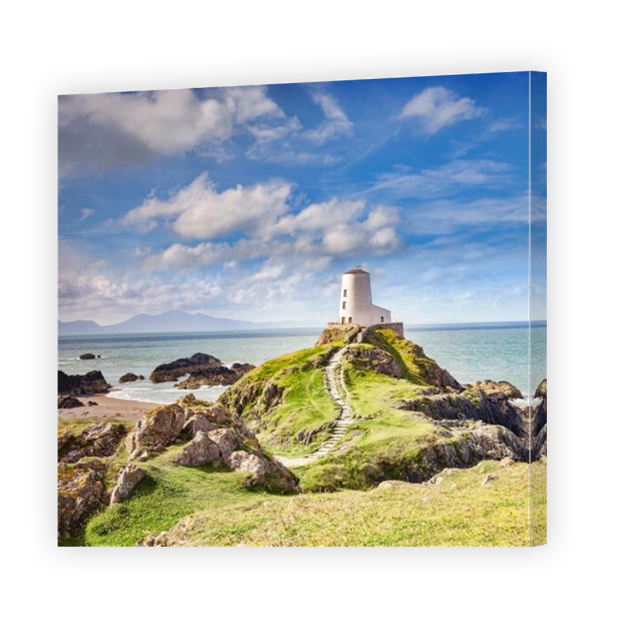 The Old Lighthouse on the tidal Island of Llanddwyn, Anglesey, Wales, UK