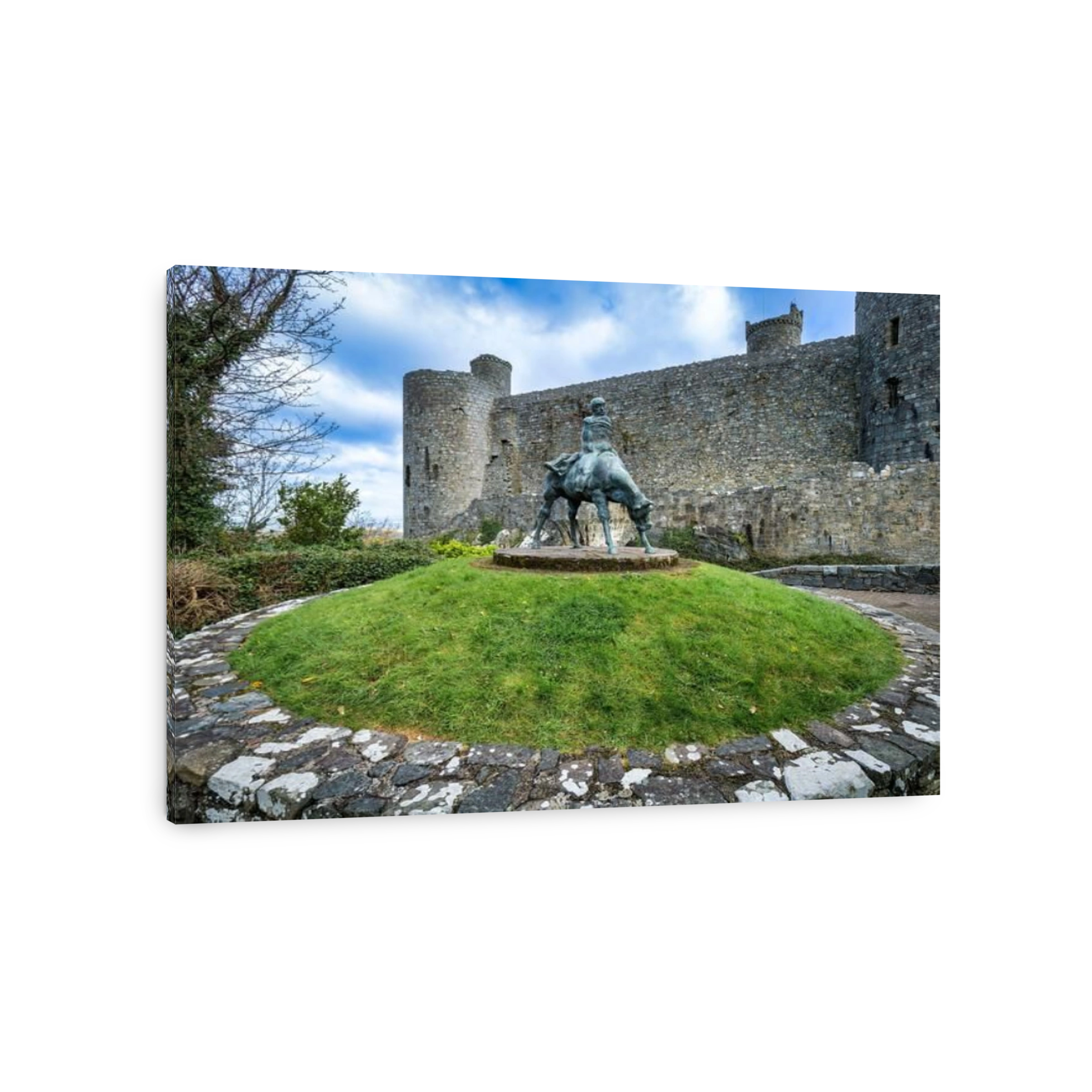 13 April 2023: Harlech, Gwynedd, Wales - The Two Kings, a statue by Ivor Roberts-Jones, outside the walls of Harlech Castle.