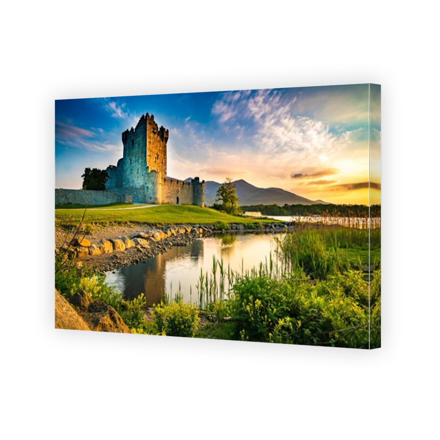 Ancient old Fortress Ross Castle ruin with lake and grass in Ireland during golden hour nobody