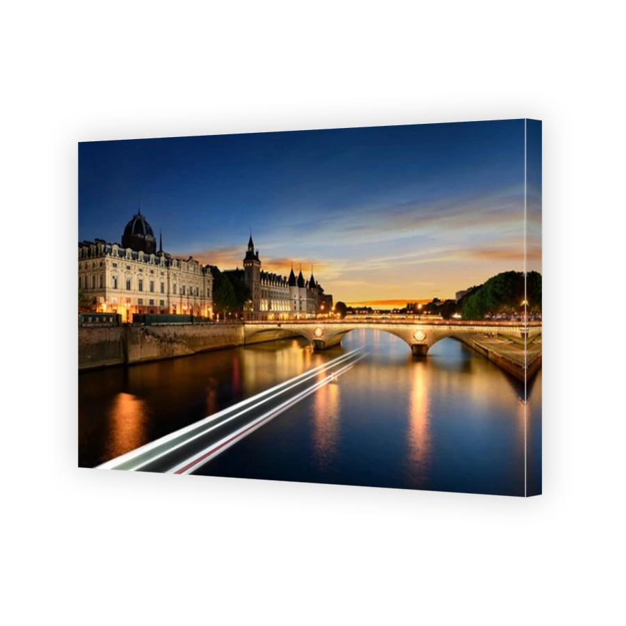 Consiergerie, Pont Neuf and Seine river with tour boat at sunny summer sunset, Paris, France