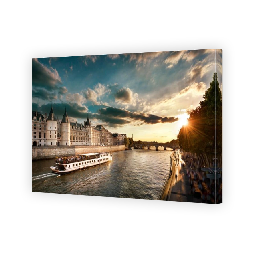 Consiergerie, Pont Neuf and Seine river with tour boat at sunny summer sunset, Paris, France