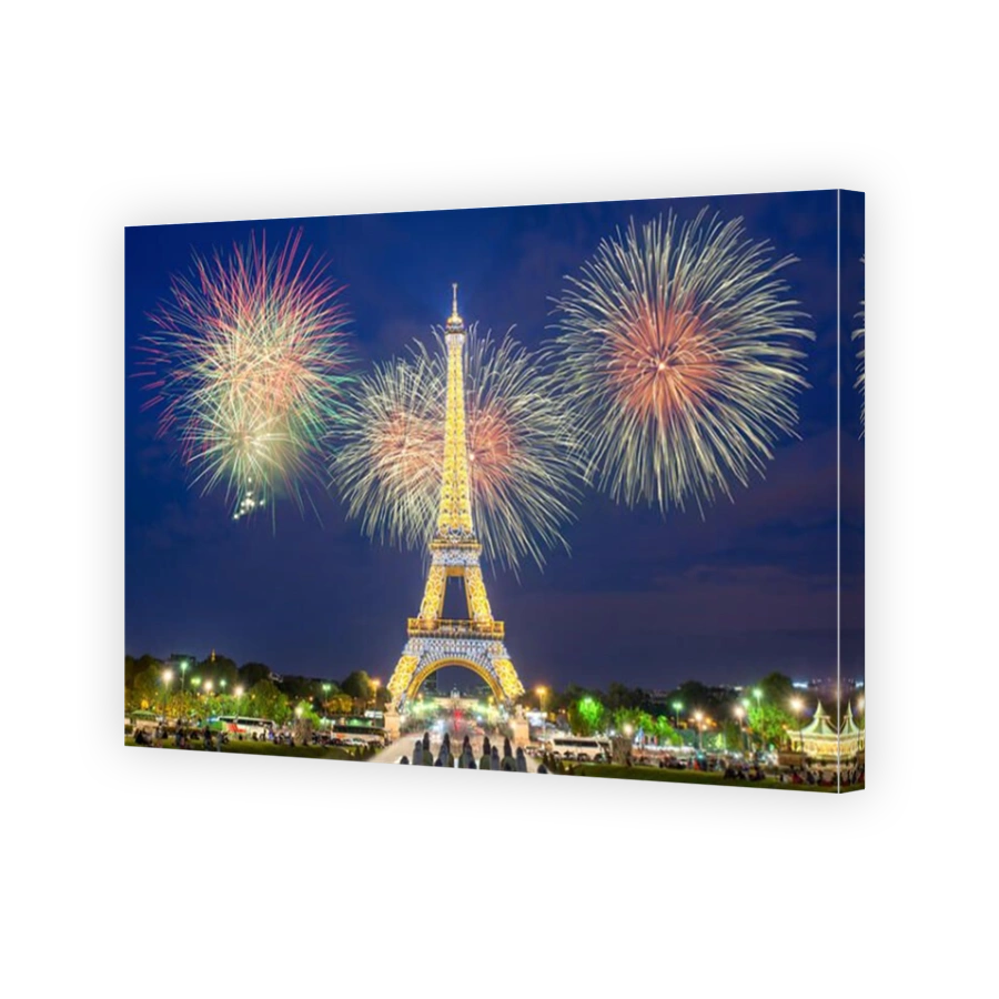 Eiffel tower light performance show and New Year 2017 fireworks in night.