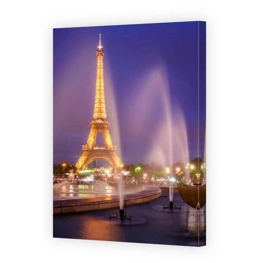 The Eiffel Tower illuminated at night with the fountains of the Trocadero. Champs-de-Mars, Paris (75)