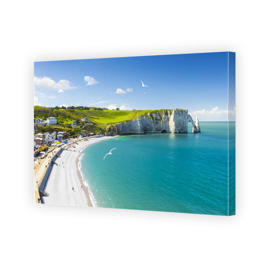Panoramic view of the beach of Etretat in Normandy, a popular french seaside town known for its chalk cliffs