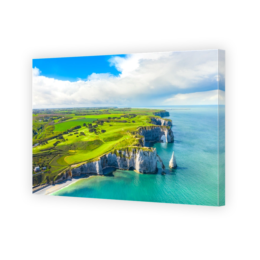 Picturesque panoramic landscape on the cliffs of Etretat. Natural amazing cliffs. Etretat, Normandy, France, La Manche or English Channel. Coast of the Pays de Caux area in sunny summer day. France