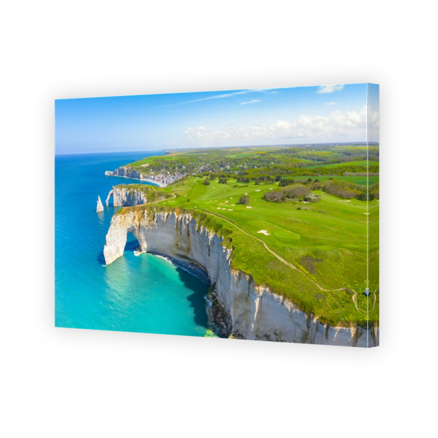 Picturesque panoramic landscape on the cliffs of Etretat. Natural amazing cliffs. Etretat, Normandy, France, La Manche or English Channel. Coast of the Pays de Caux area in sunny summer day. France