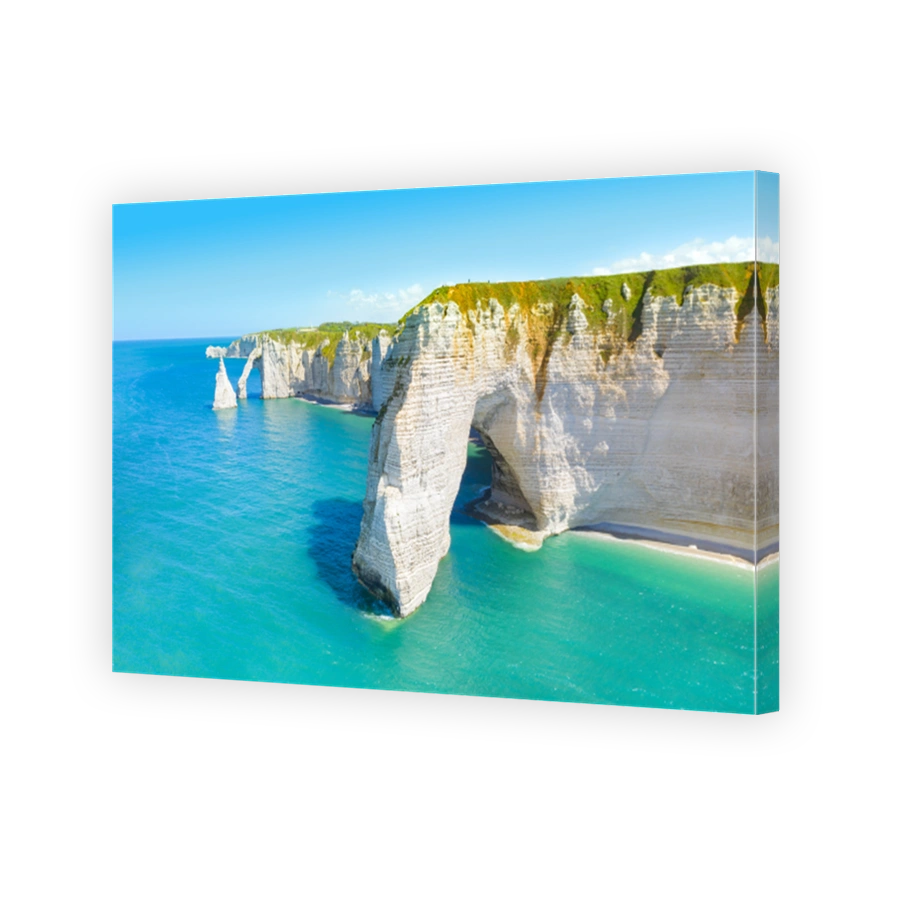 Picturesque panoramic landscape on the cliffs of Etretat. Natural amazing cliffs. Etretat, Normandy, France, La Manche or English Channel. Coast of the Pays de Caux area in sunny summer day. France