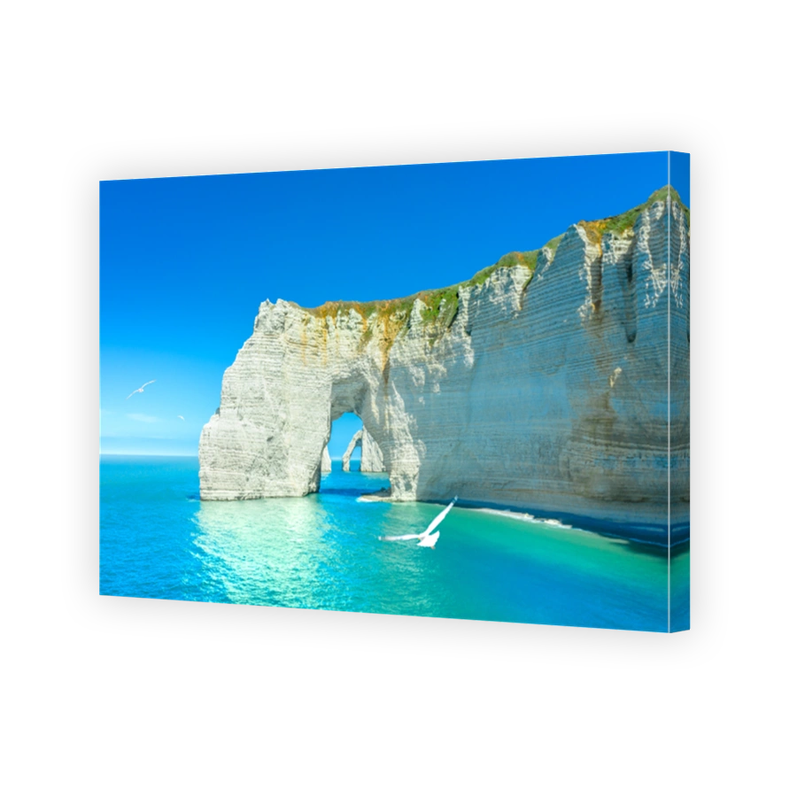 Picturesque panoramic landscape on the cliffs of Etretat. Natural amazing cliffs. Etretat, Normandy, France, La Manche or English Channel. Coast of the Pays de Caux area in sunny summer day. France