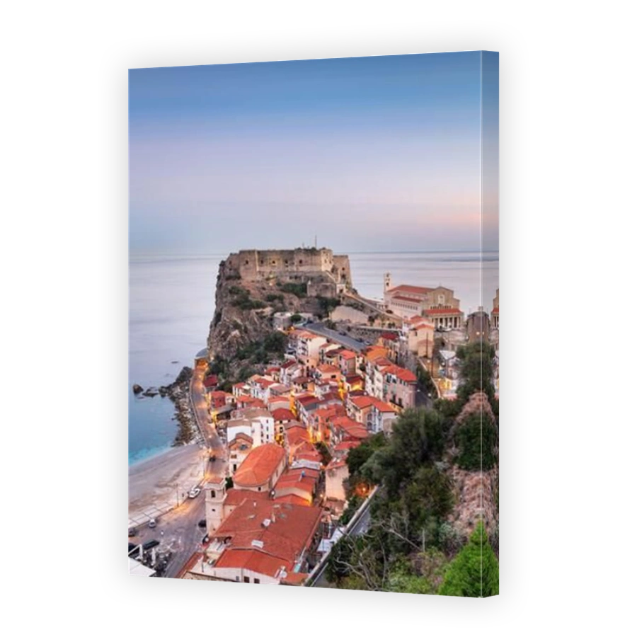 Scilla, Italy historic townscape on the coast of the Mediterranean Sea at dawn.