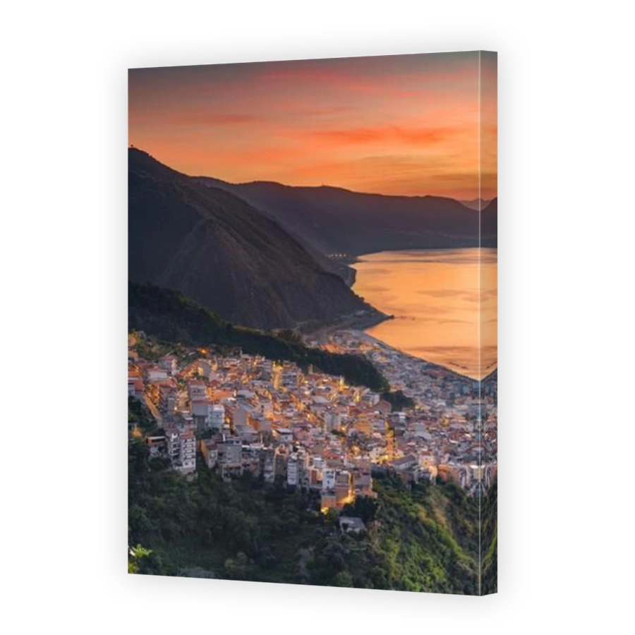 Bagnara Calabra, Italy cityscape overlooking the Tyrrhenian Sea at dusk.
