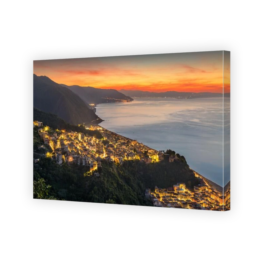 Bagnara Calabra, Italy cityscape overlooking the Tyrrhenian Sea at dusk.