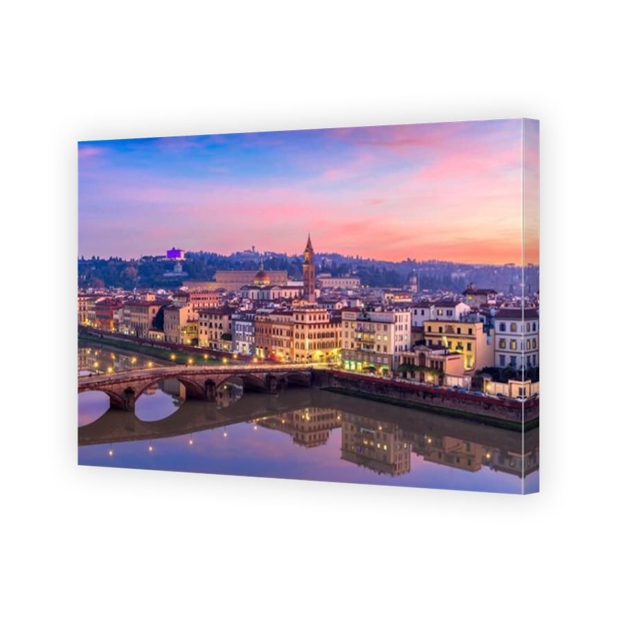 Florence, Italy overlooking the Arno River at twilight.
