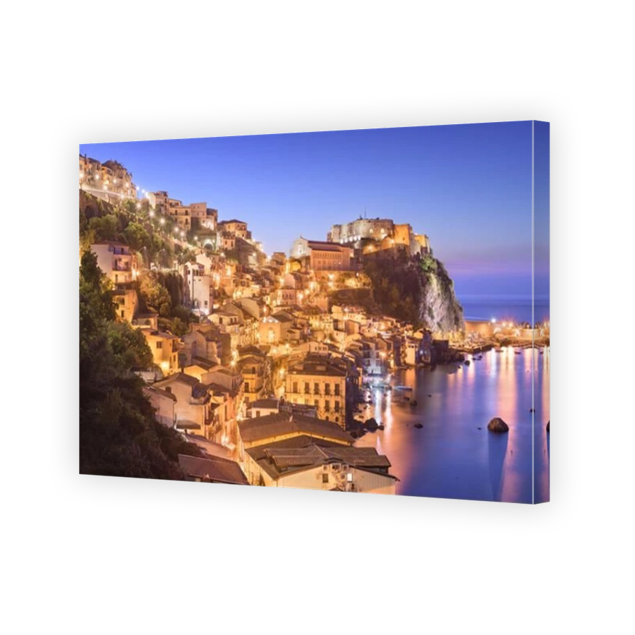 Scilla, Italy on the Mediterranean coast at twilight.