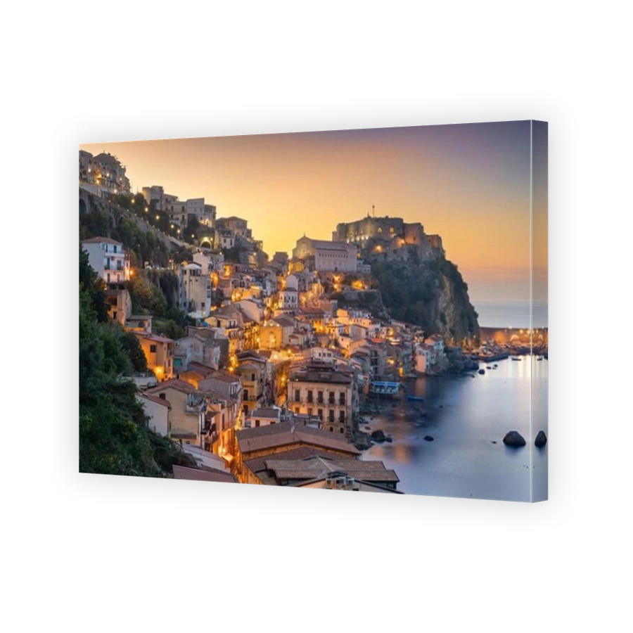 Scilla, Italy on the Mediterranean coast at dusk.