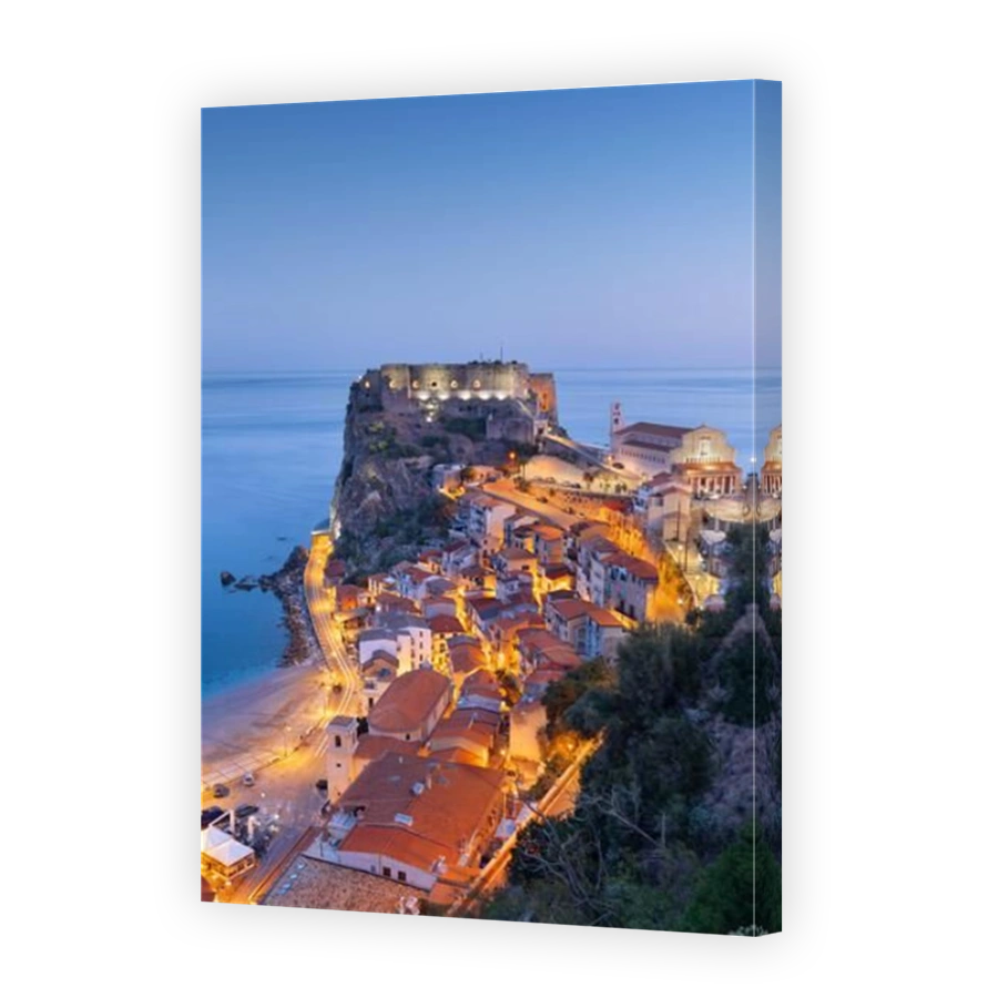 Scilla, Italy on the Mediterranean coast at twilight.